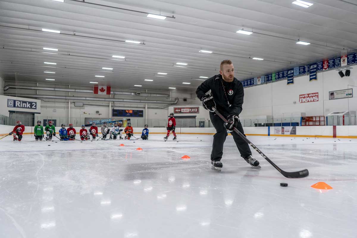 Coach Jon Woodyard running a Spartans skills session